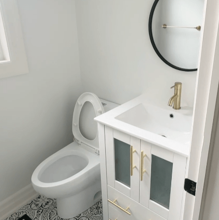 full service bathroom design. white marble floor and wooden bathroom vanity